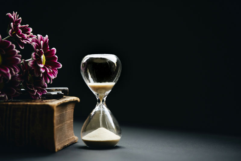 image of flower and sand timer